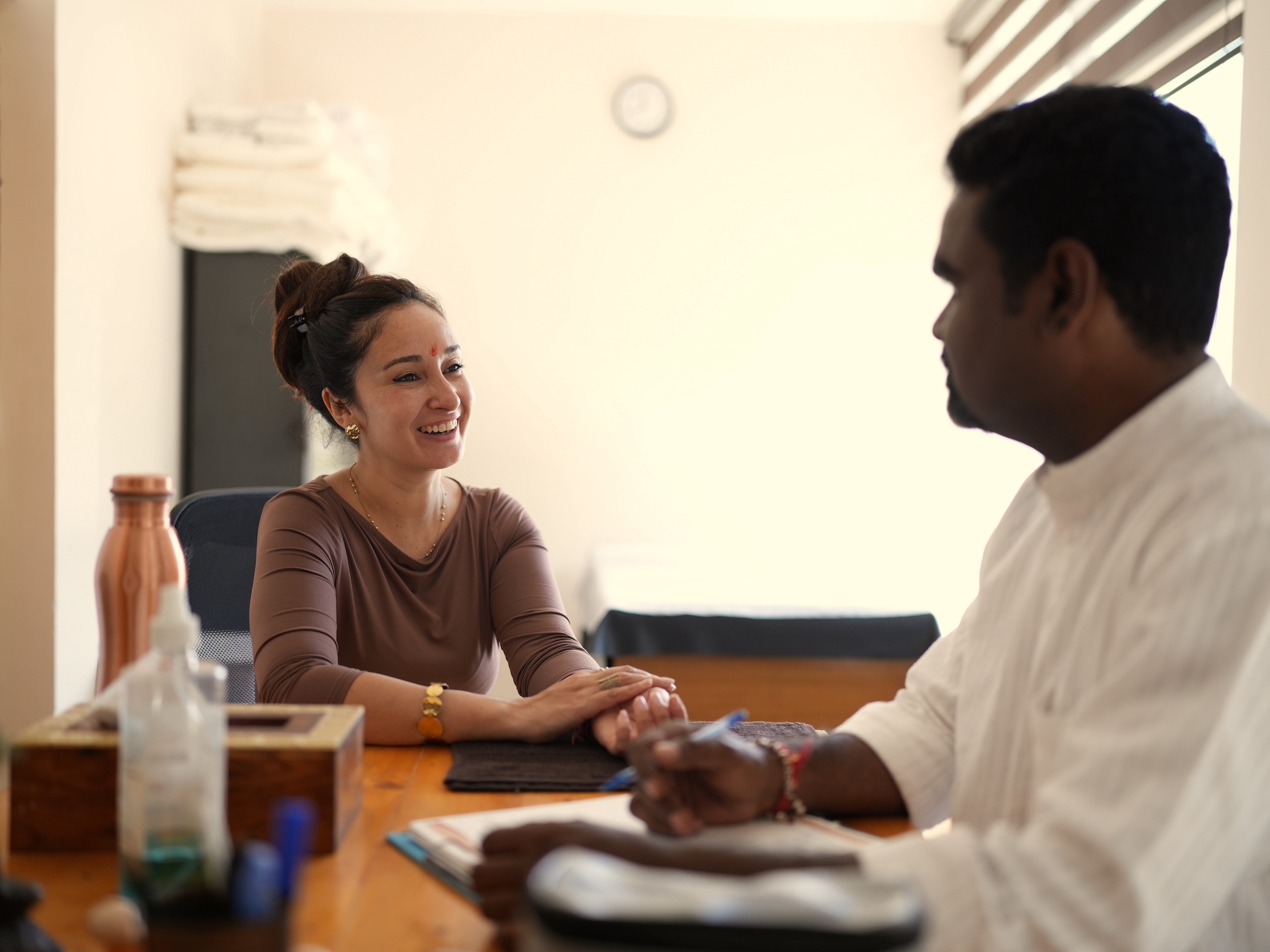 A student in a one-on-one Ayurveda consultation with the resident doctor at Rishikesh Yogpeeth