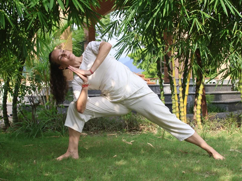 Students practicing yoga asanas during teacher training in Rishikesh