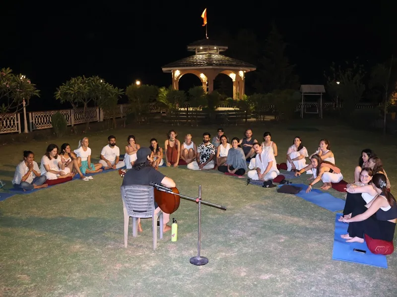 Joyful celebration with yoga students at Rishikesh Yogpeeth