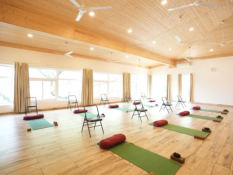 Spacious yoga hall at Rishikesh Yogpeeth for teacher training