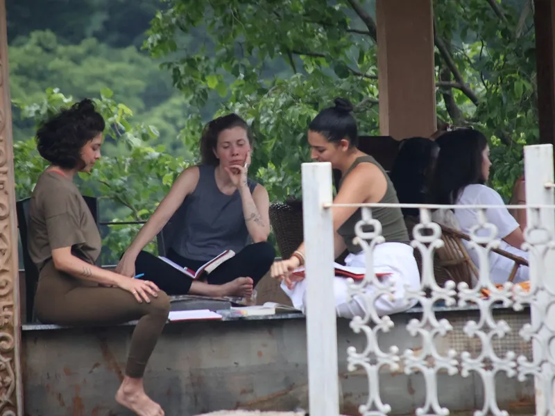 Outdoor yoga and relaxation session in Rishikesh Yogpeeth ashram