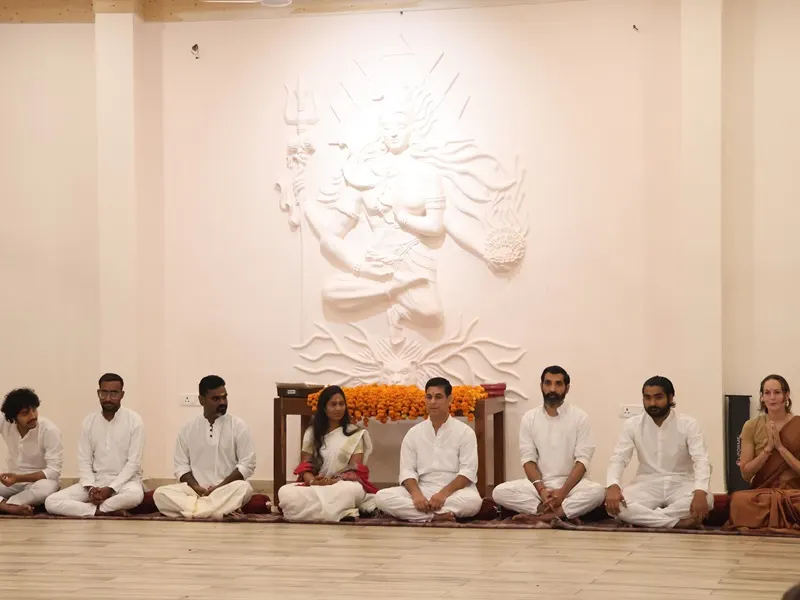 Indoor yoga class session with students at Rishikesh Yogpeeth Best Yoga Ashram