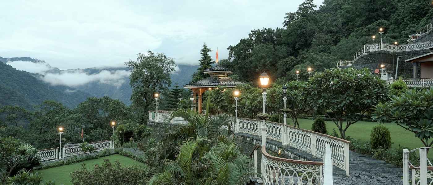 Landscaped gardens and Himalayan mountain views from Rishikesh Yogpeeth Ashram, yoga retreat in Rishikesh India