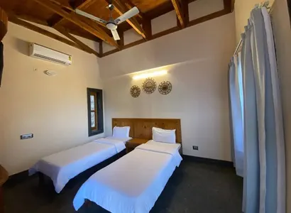 Clean and cozy twin shared room with modern amenities in Rishikesh